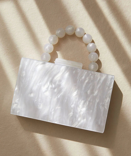 Skulpturel clutch med perlehank
