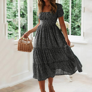 Blomstrende midi-kjole med feminin charme