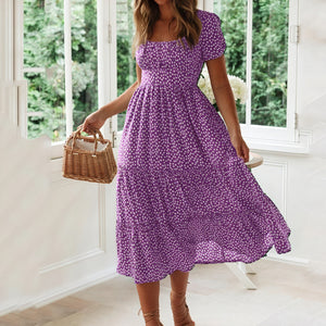 Blomstrende midi-kjole med feminin charme