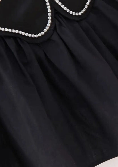 Blomstertop med Peplum og Halterneck